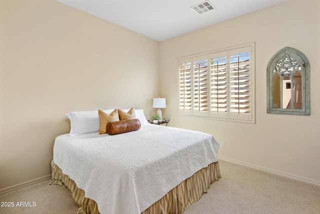 bedroom with visible vents, baseboards, and carpet