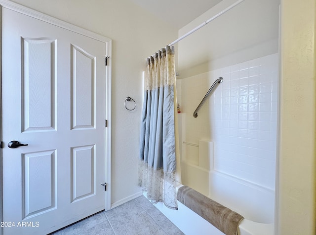 bathroom featuring tile patterned floors and shower / tub combo