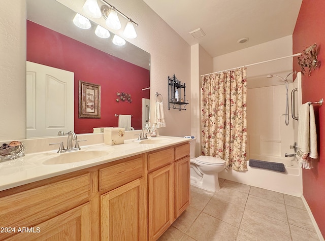 full bathroom with tile patterned floors, shower / bath combo, toilet, and vanity