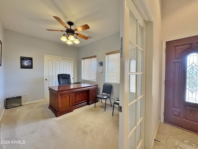 home office featuring ceiling fan, french doors, and light colored carpet