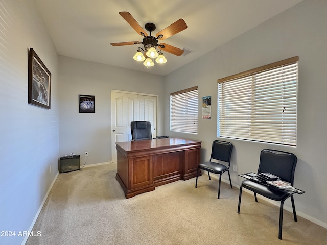 carpeted office featuring ceiling fan