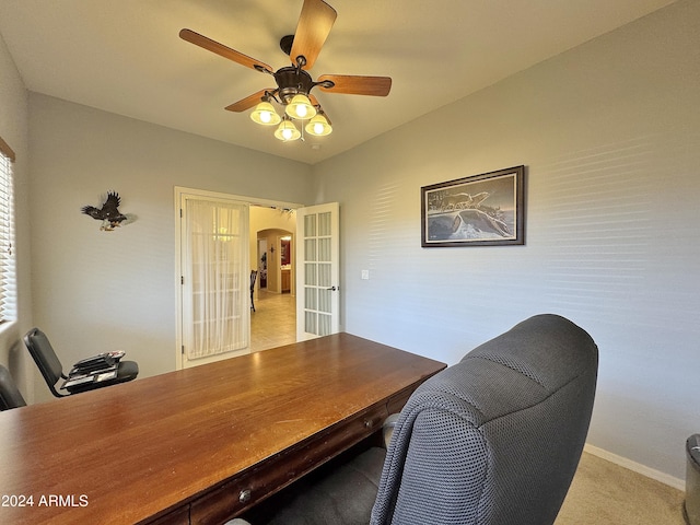 office featuring ceiling fan, french doors, and light colored carpet