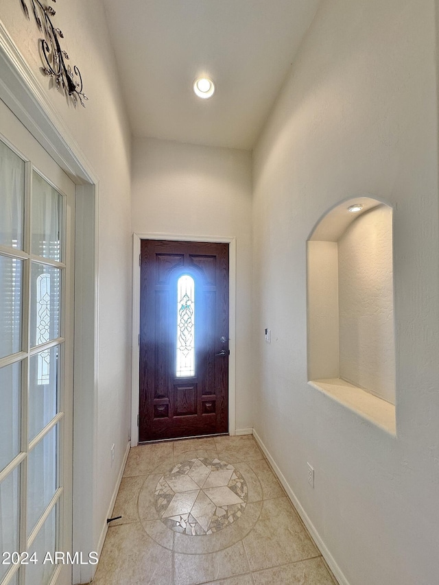 foyer featuring light tile patterned floors