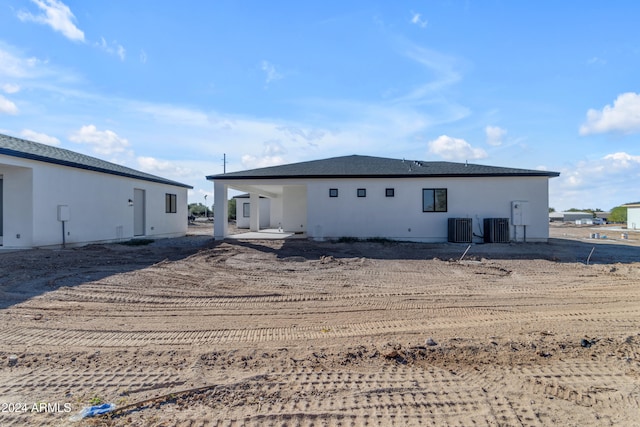 back of property featuring cooling unit