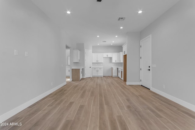 unfurnished living room featuring light hardwood / wood-style flooring