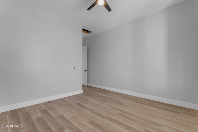 unfurnished room featuring ceiling fan and light hardwood / wood-style flooring