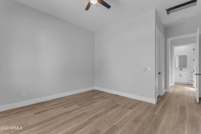 unfurnished room featuring light wood-type flooring and ceiling fan