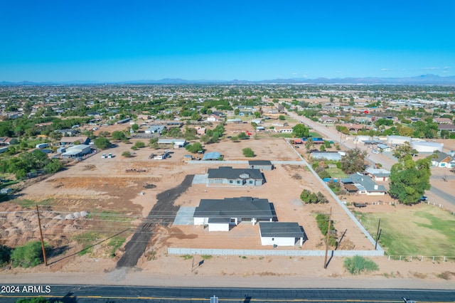 birds eye view of property with a mountain view