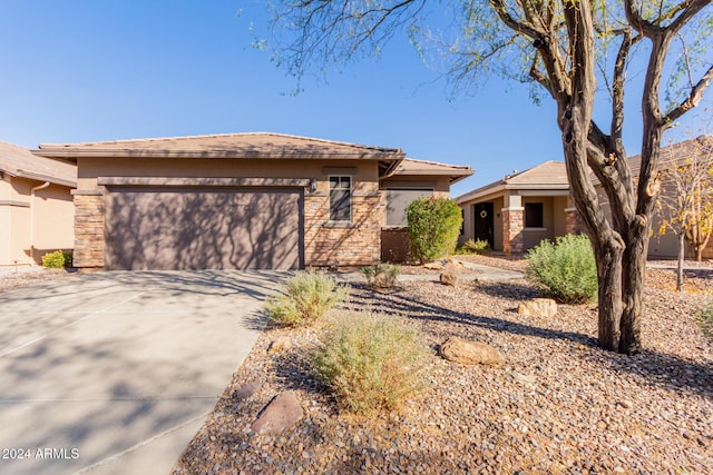 prairie-style home featuring a garage