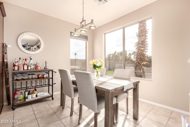 dining area featuring light tile patterned floors