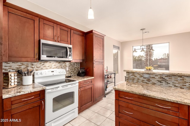 kitchen featuring light stone countertops, a notable chandelier, backsplash, white electric stove, and pendant lighting