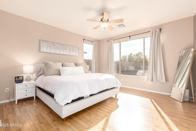 bedroom featuring ceiling fan and light hardwood / wood-style floors