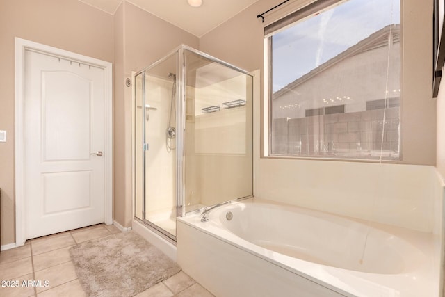 bathroom with tile patterned floors and separate shower and tub