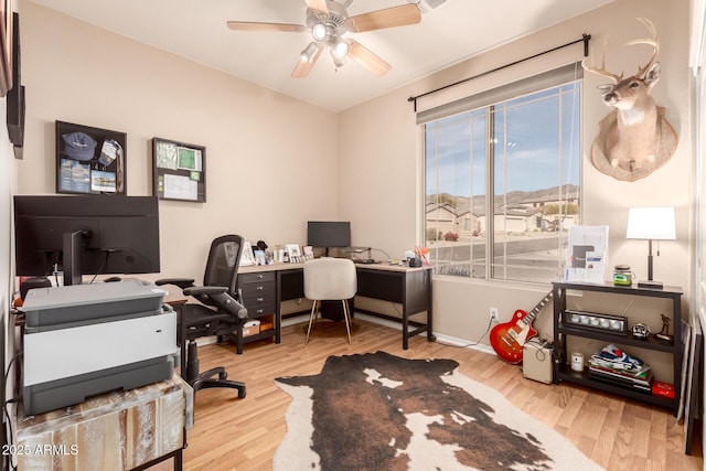 office area with hardwood / wood-style flooring and ceiling fan