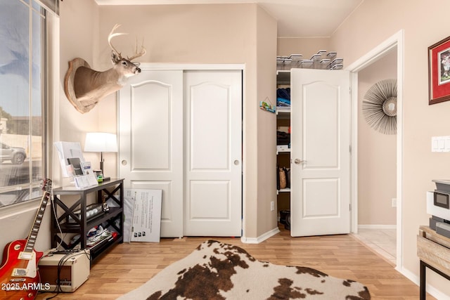 bedroom featuring light hardwood / wood-style floors and a closet