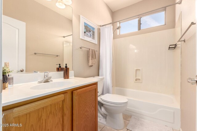 full bathroom with tile patterned floors, vanity, shower / bath combo, and toilet