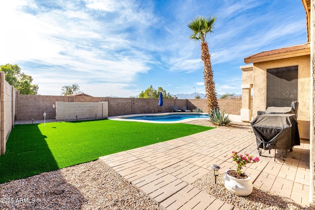 view of patio featuring a grill and a fenced in pool