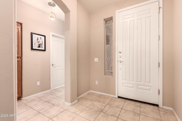 entrance foyer with light tile patterned floors