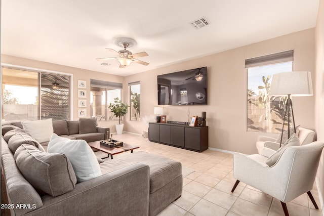 tiled living room featuring ceiling fan