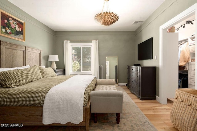 bedroom featuring light wood-type flooring