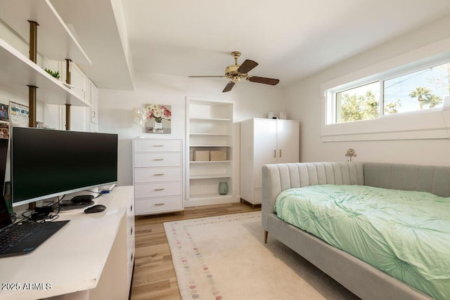 bedroom with light wood-type flooring and ceiling fan