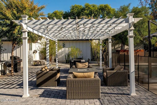 view of patio / terrace with grilling area, a pergola, and an outdoor living space