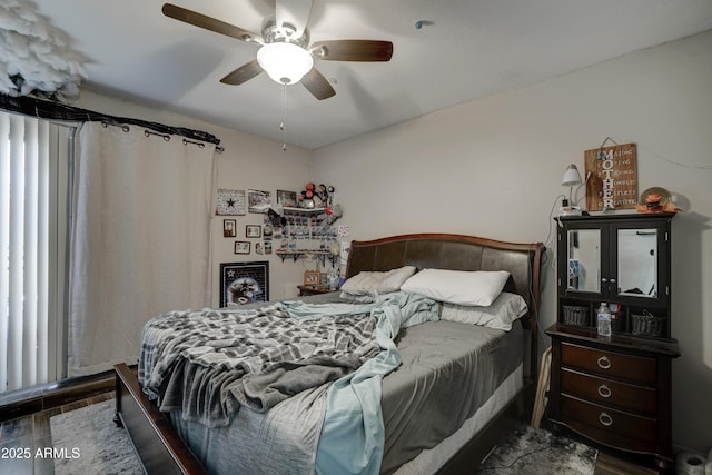 bedroom featuring hardwood / wood-style flooring and ceiling fan