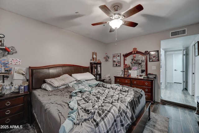 bedroom featuring dark wood-type flooring and ceiling fan