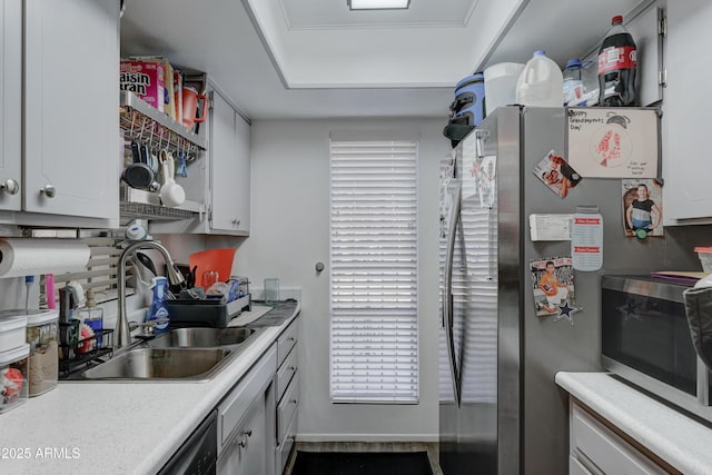 kitchen featuring white cabinetry, appliances with stainless steel finishes, and sink