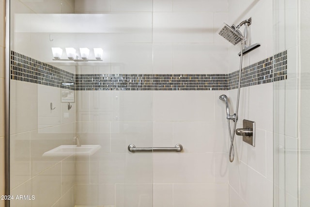 bathroom with a tile shower
