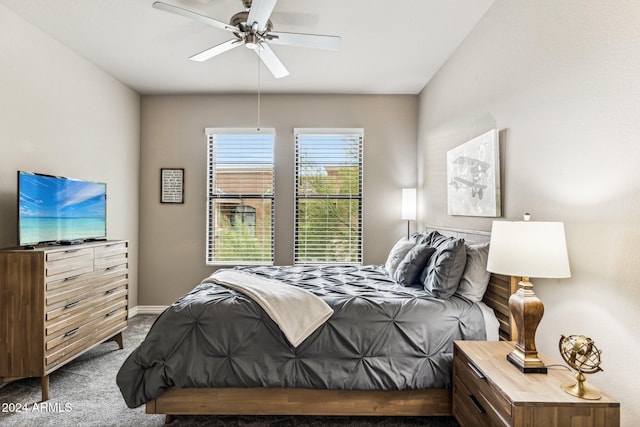 bedroom with ceiling fan, carpet floors, and baseboards