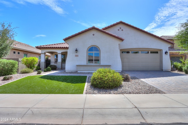 mediterranean / spanish house featuring a garage