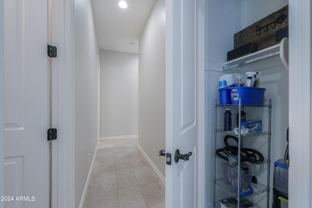 corridor with light tile patterned floors