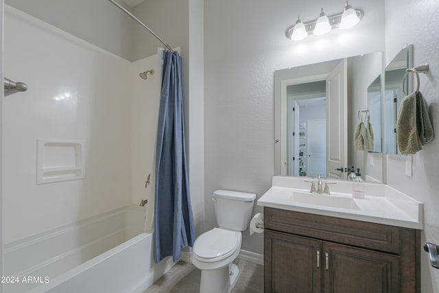 full bathroom featuring toilet, shower / bath combo with shower curtain, vanity, and tile patterned floors