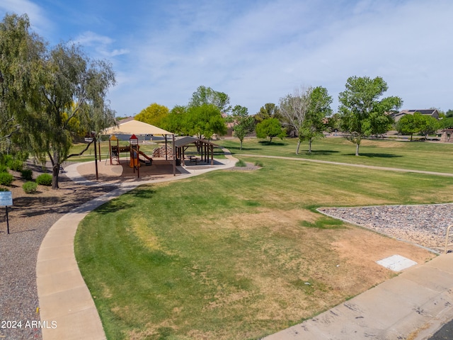 view of community with a playground and a lawn