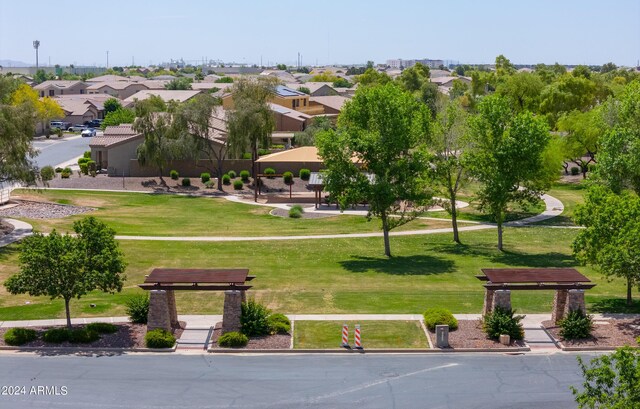 view of property's community featuring a yard