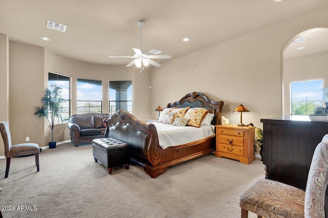 bedroom featuring light carpet and ceiling fan