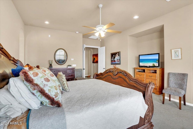 bedroom featuring light colored carpet and ceiling fan