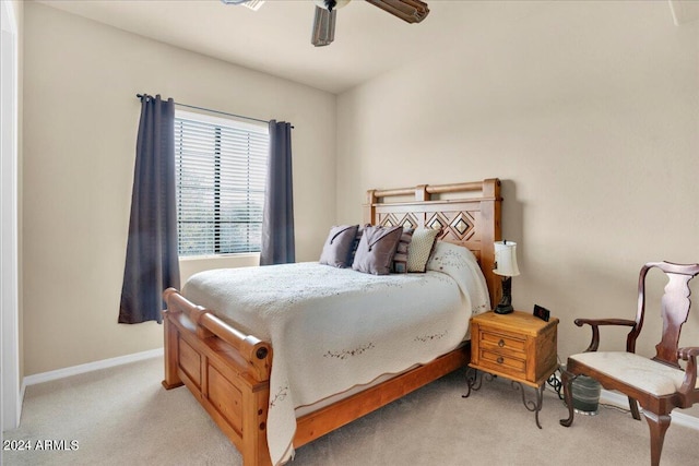 bedroom with light carpet and ceiling fan