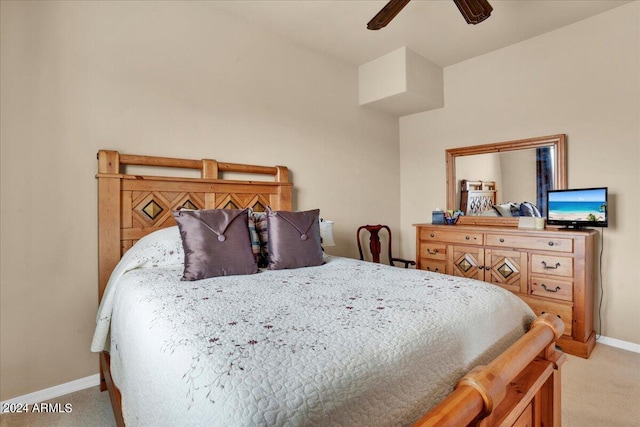 bedroom with light carpet and ceiling fan