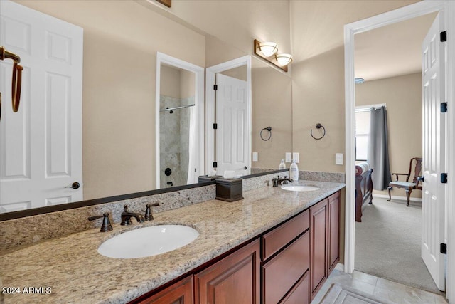 bathroom featuring dual sinks, tile floors, and large vanity