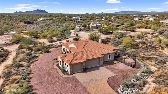 birds eye view of property with a mountain view