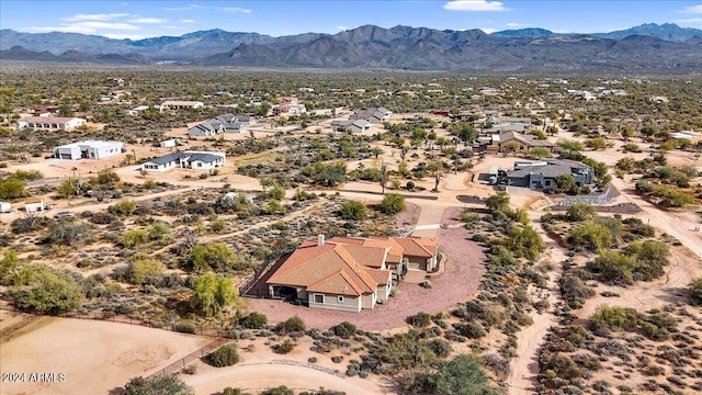 birds eye view of property featuring a mountain view