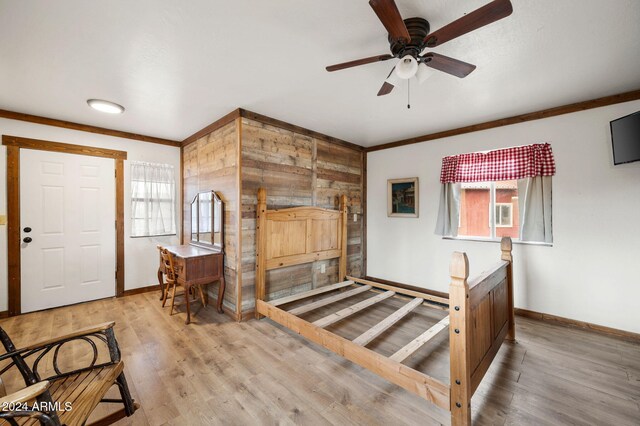 entrance foyer featuring ceiling fan, a healthy amount of sunlight, and light wood-type flooring