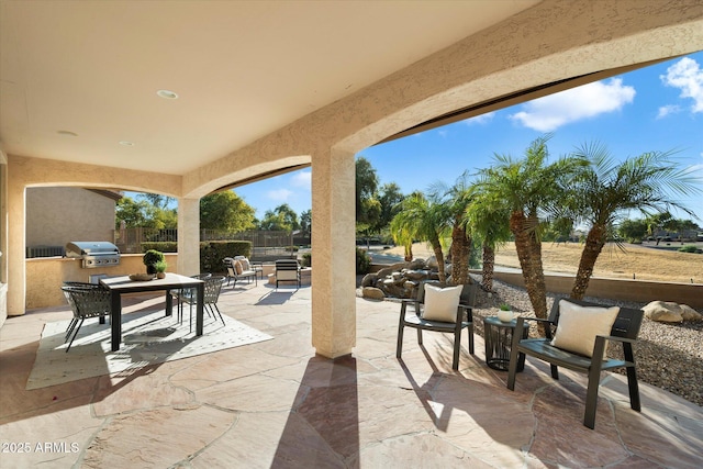 view of patio / terrace featuring a grill and an outdoor kitchen