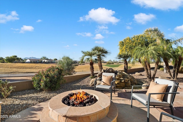 view of patio / terrace with a fire pit