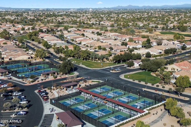 birds eye view of property with a mountain view