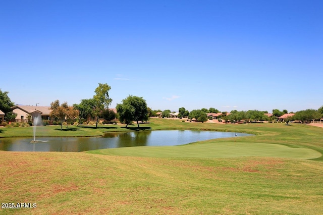 view of community with a water view and a yard