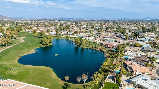 drone / aerial view featuring a water and mountain view