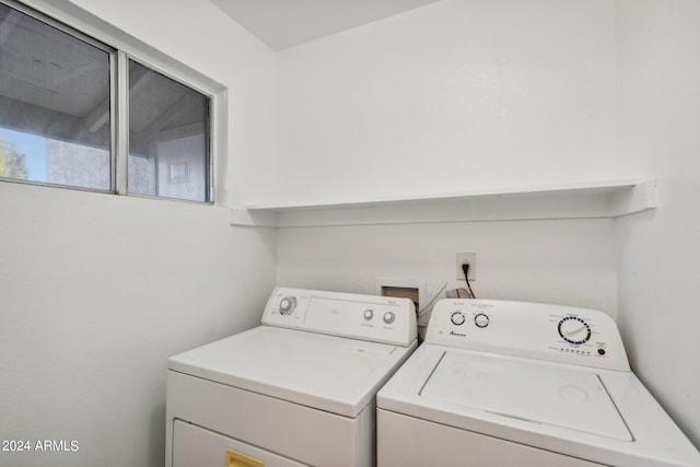 laundry area with independent washer and dryer